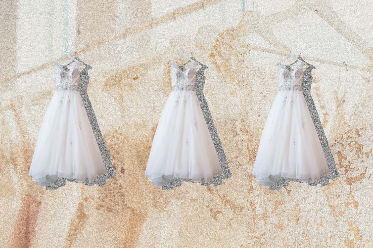 Three wedding dresses hanging