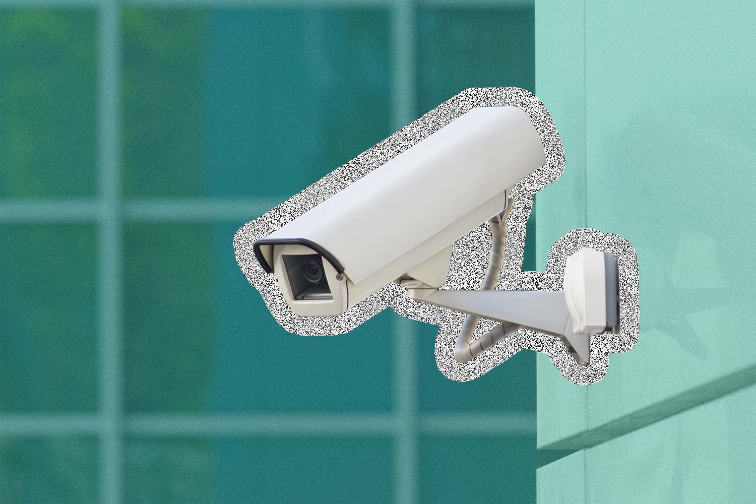 Security camera attached to a building
