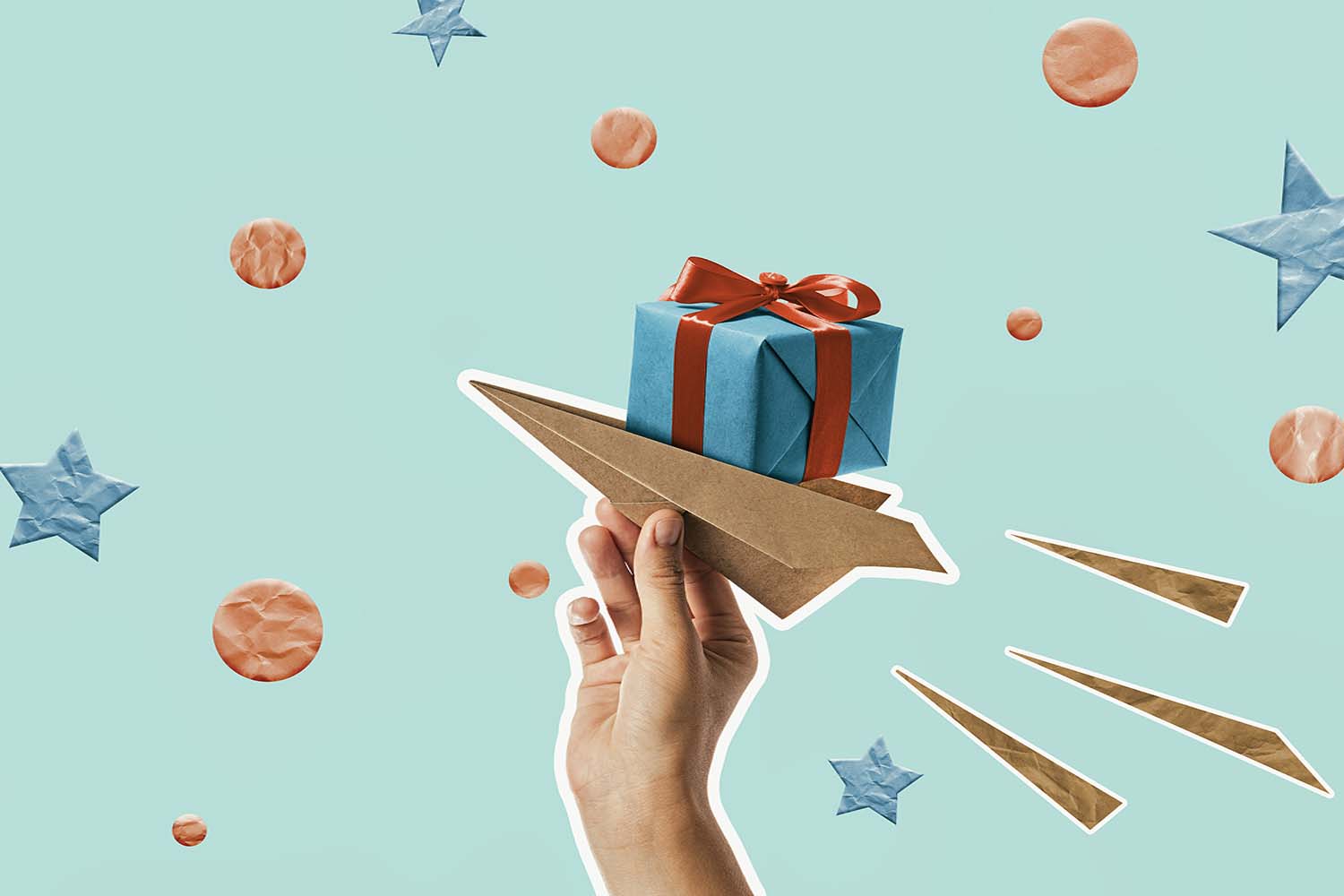 Gift sitting on top of a hand throwing a paper airplane