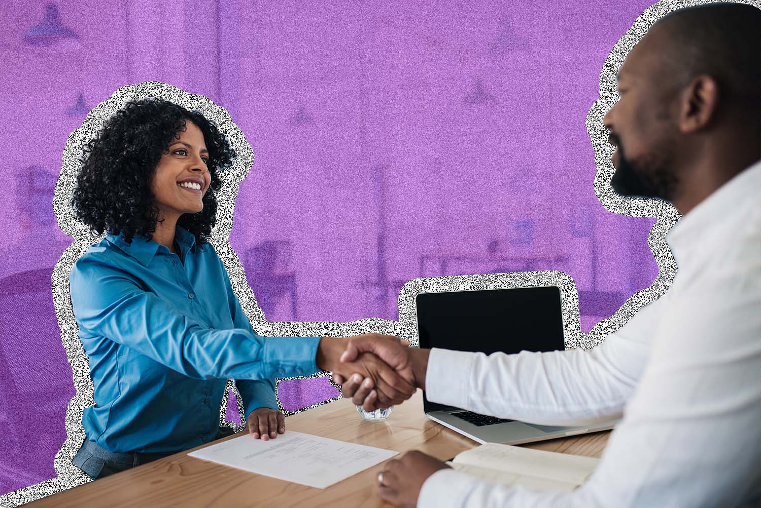 Woman and man shake hands in job interview