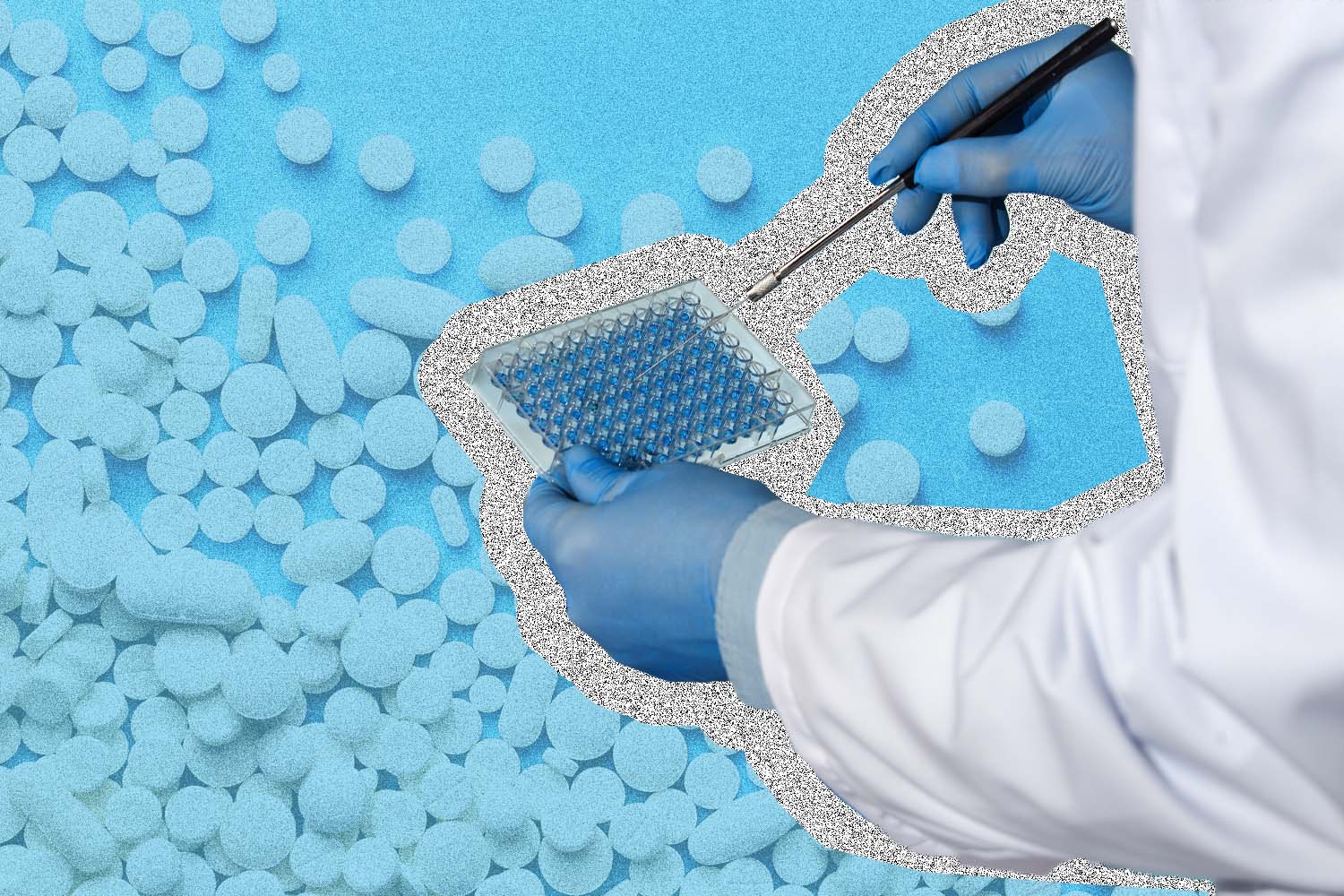 Person holding pipette over a pile of pills