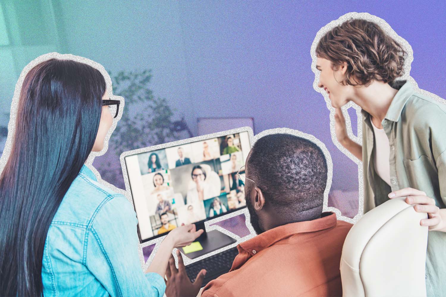 Three people gathered around a computer for a meeting