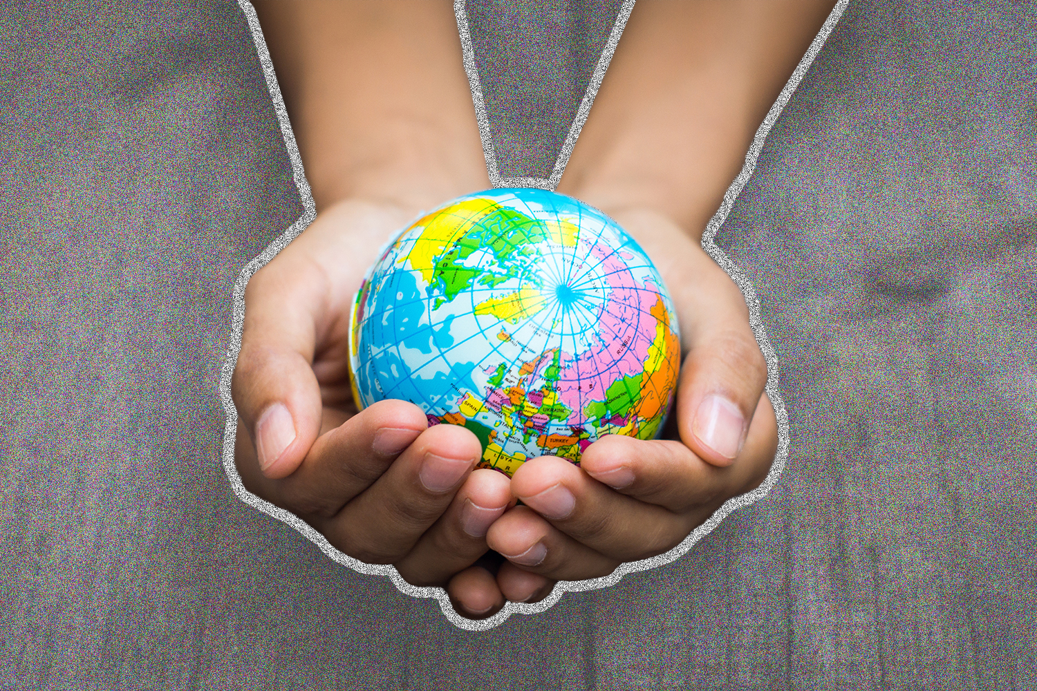 Image of person holding a globe of the world