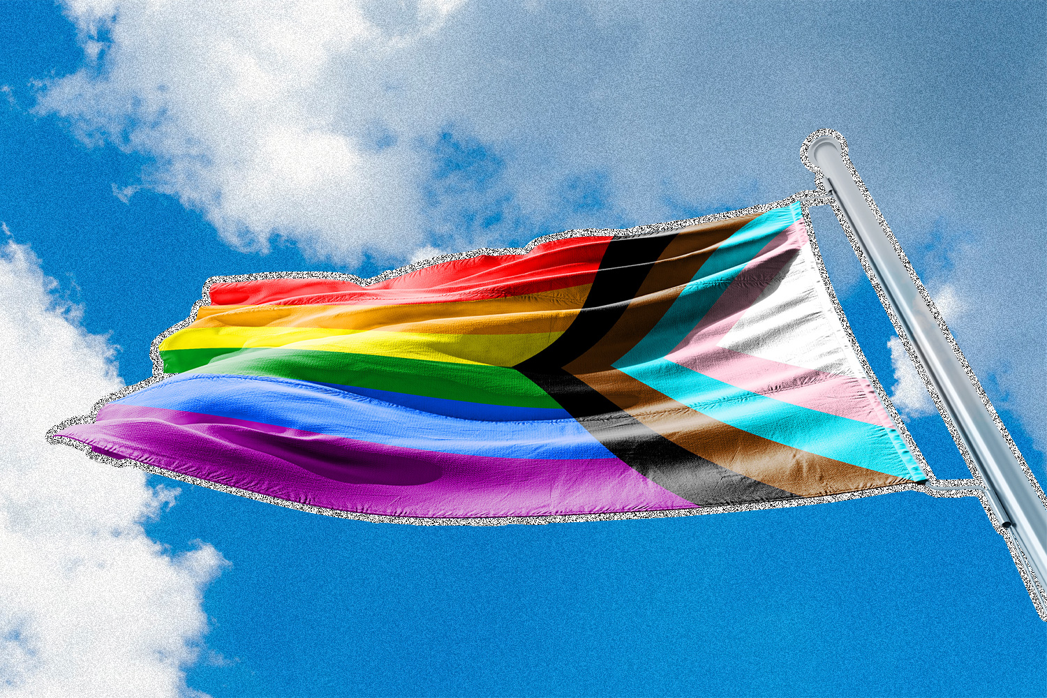 The LGBTQIA flag waving against a blue sky background.
