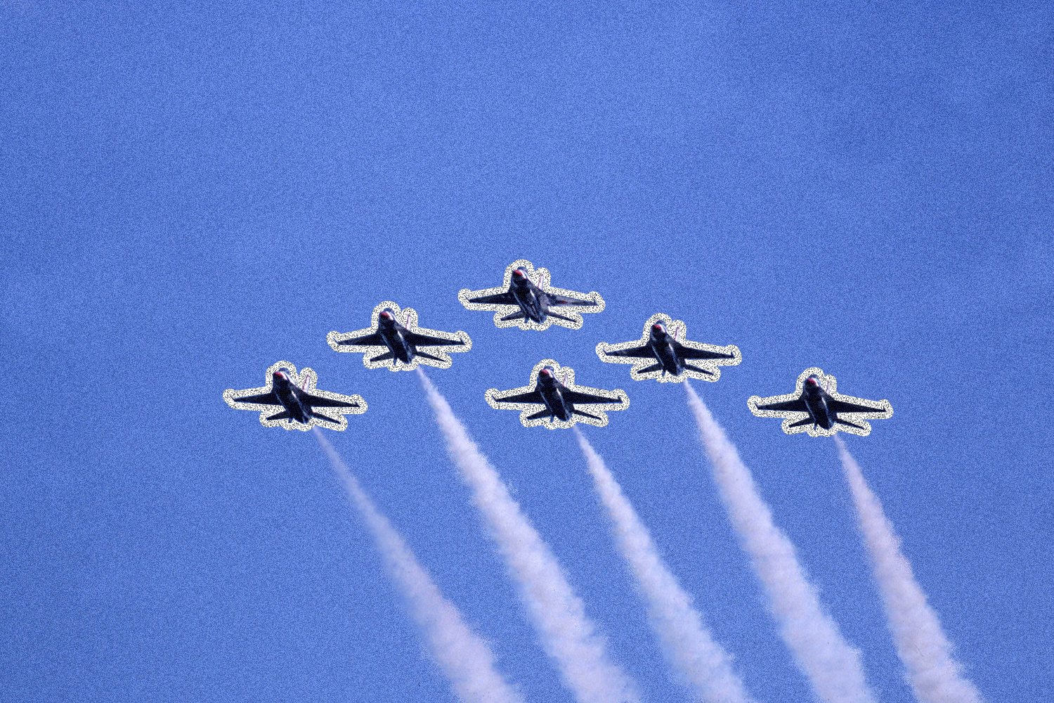 Six fighter jets flying in V-formation across a blue sky