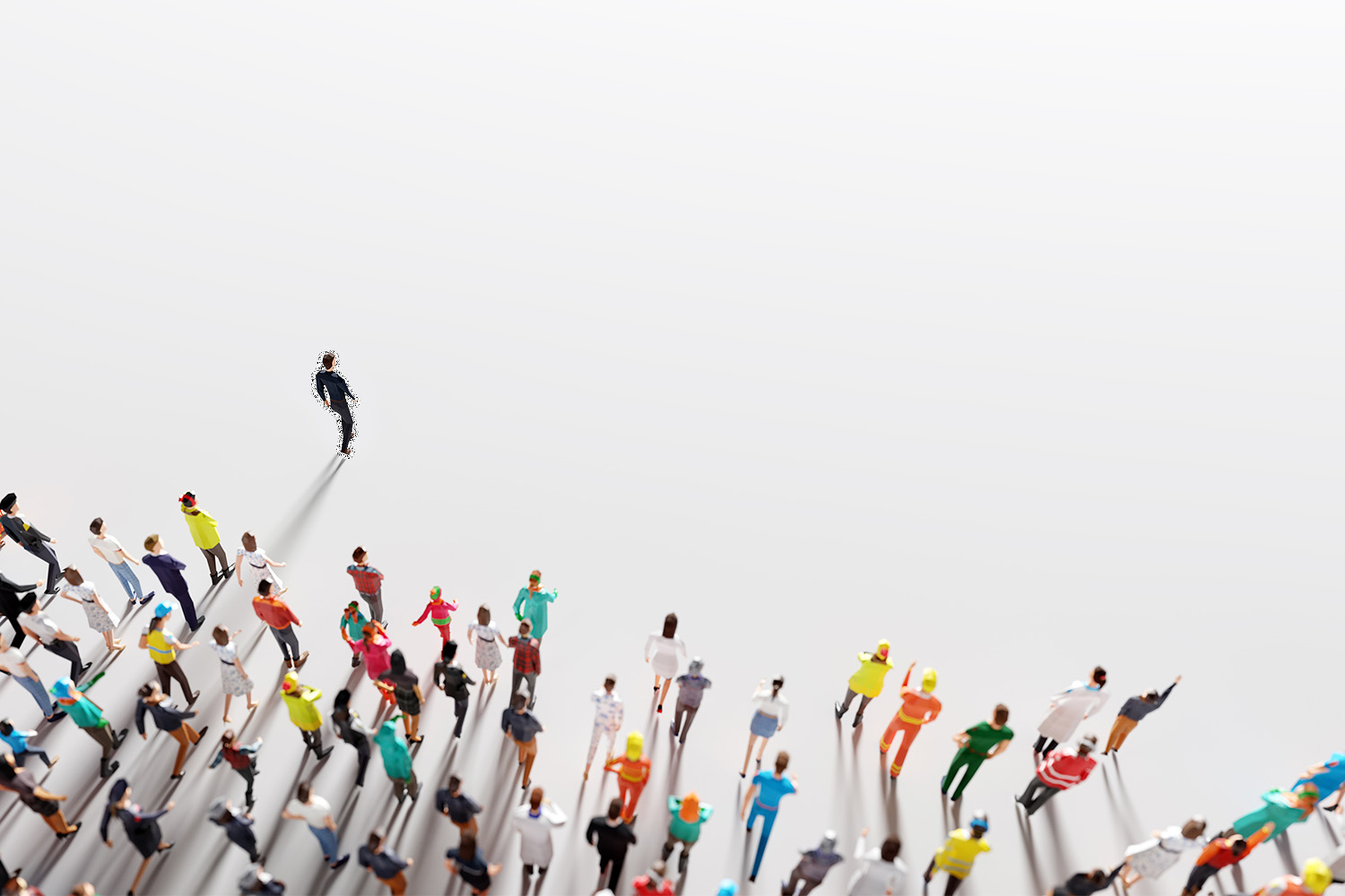 An aerial view of people walking in the same direction, following a leader in talent development