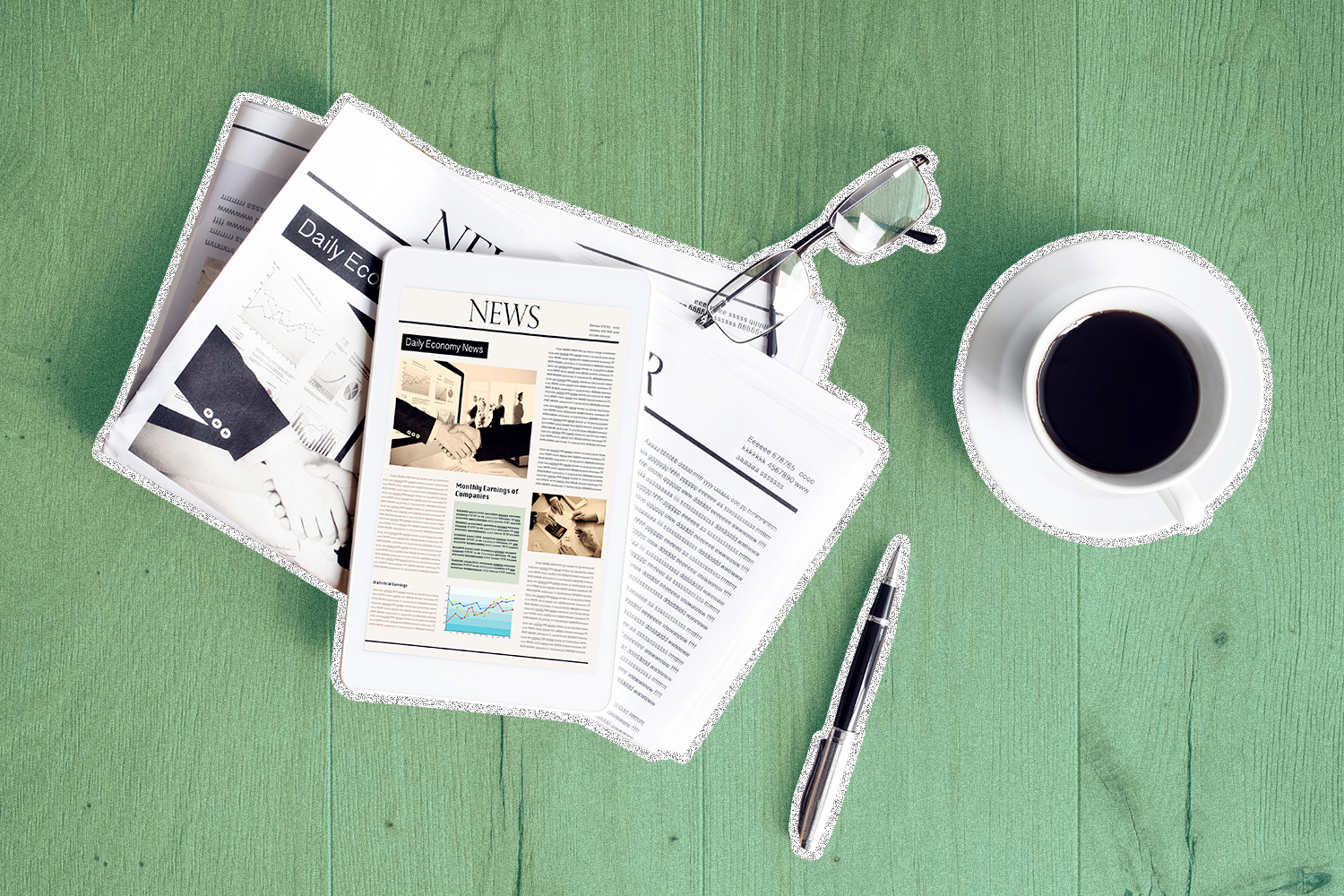 A bird's-eye view of an open newspaper and coffee cup atop a green surface.